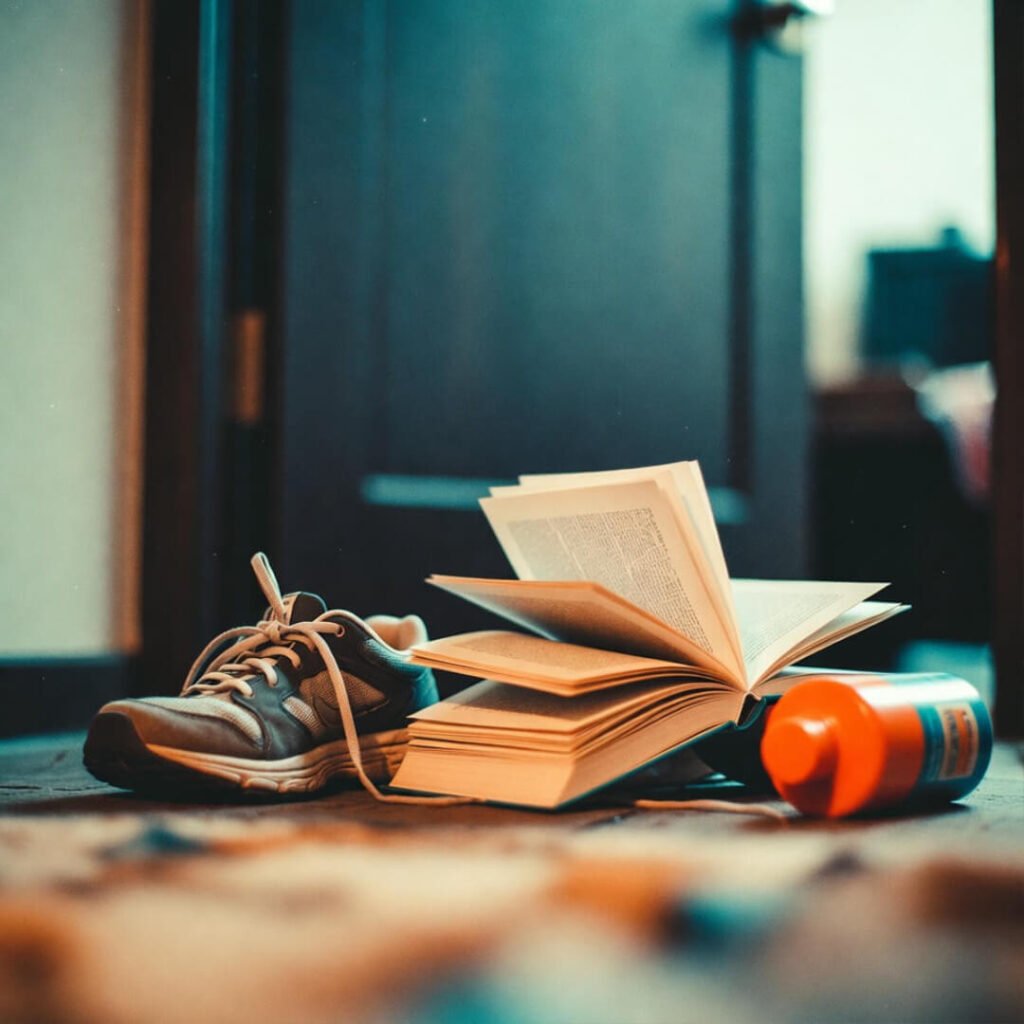 Discarded sneakers, book, and bottle after burnout.
